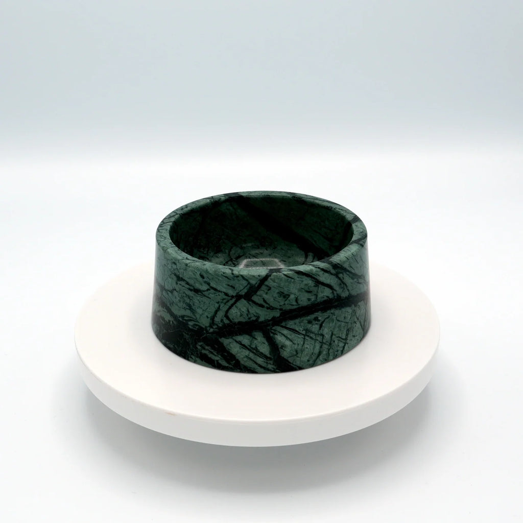 Green marble pet bowl with dark veining on a round white stand