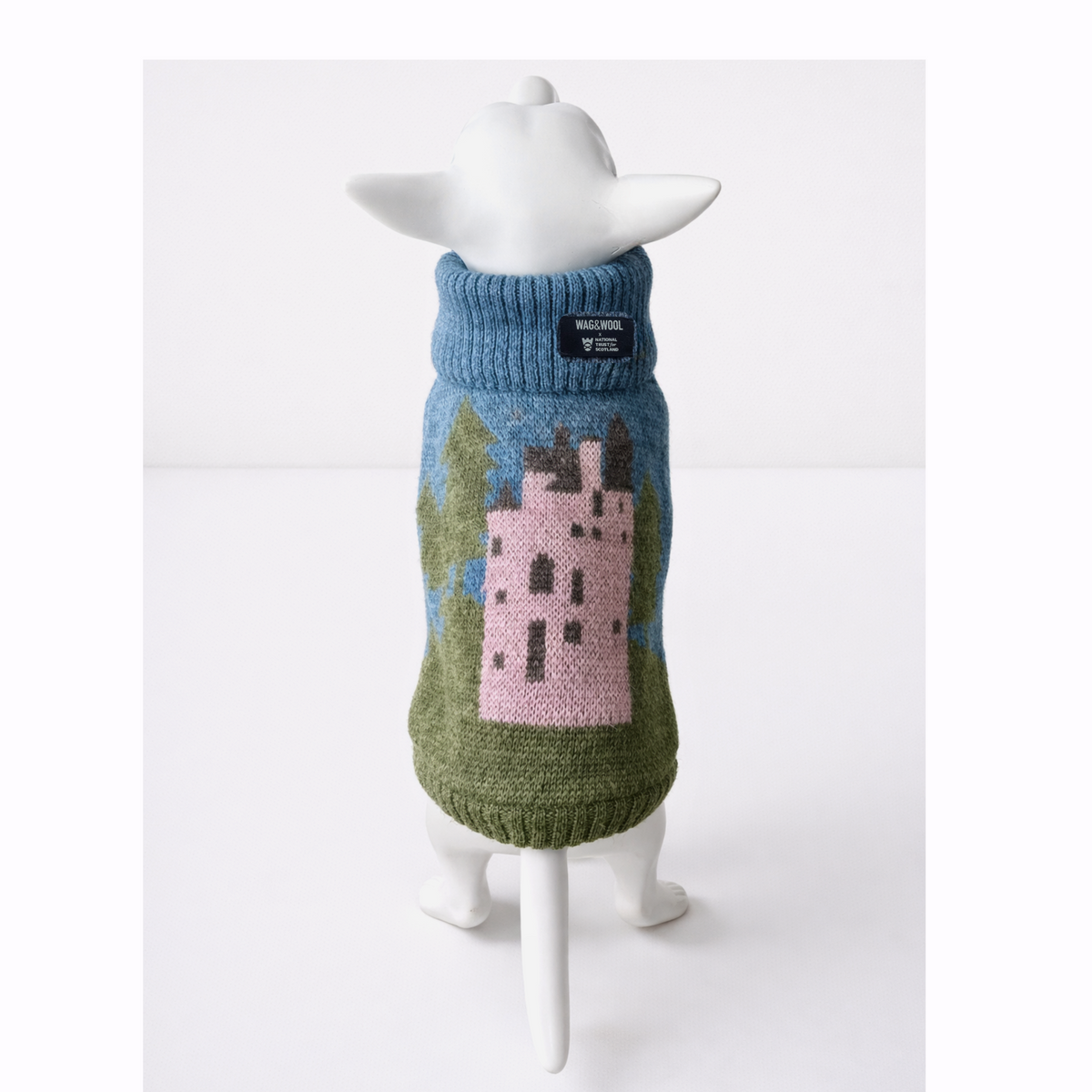 Pink castle British wool dog jumper on a white mannequin, back view