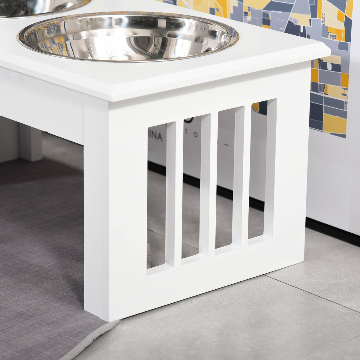 Close-up of the white slatted feeder stand holding a stainless steel bowl