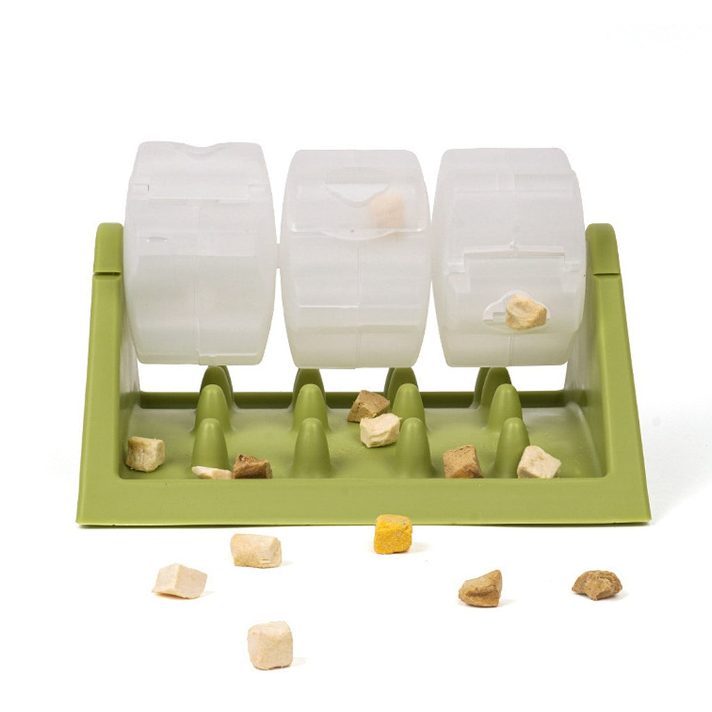 Green rotating slow feeder with clear drums and treats