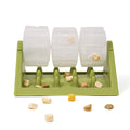 Green rotating slow feeder with clear drums and treats