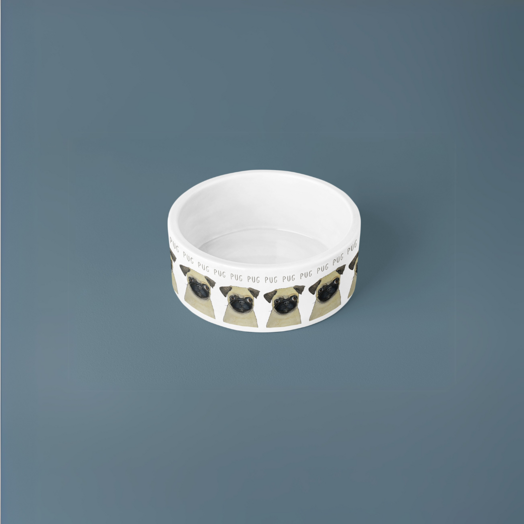 Top view of the white pug ceramic dog bowl showing its glazed inside, on a slate blue background
