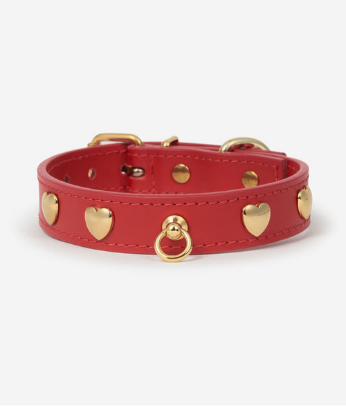 Red leather dog collar with gold heart studs and a small gold ID tag ring