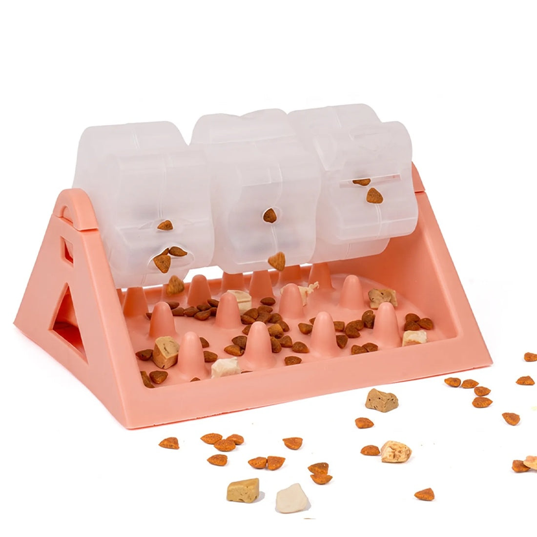 Pink puzzle feeder with kibble spilling from the drums