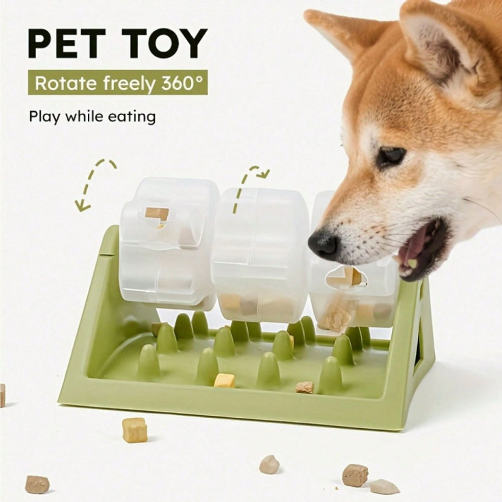 Dog nosing the green rotating puzzle feeder to find treats