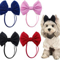 Four sparkly bow headbands in navy, pink, black and red, with a Maltese