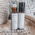 Two 10ml amber aromatherapy rollerball bottles for dogs with dried lavender