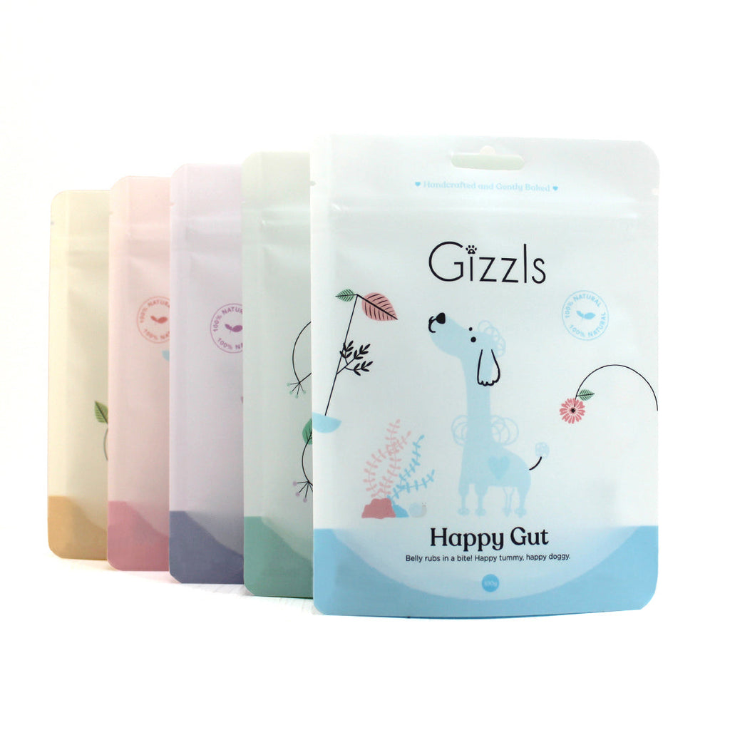 Gizzls Happy Gut 100g pouch in front of other pastel Gizzls pouches