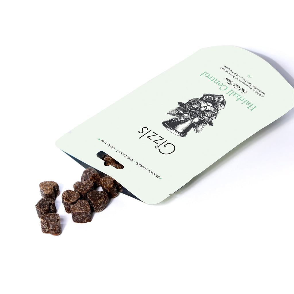 Open Gizzls soft cat treats pouch with small dark liver bites spilling out