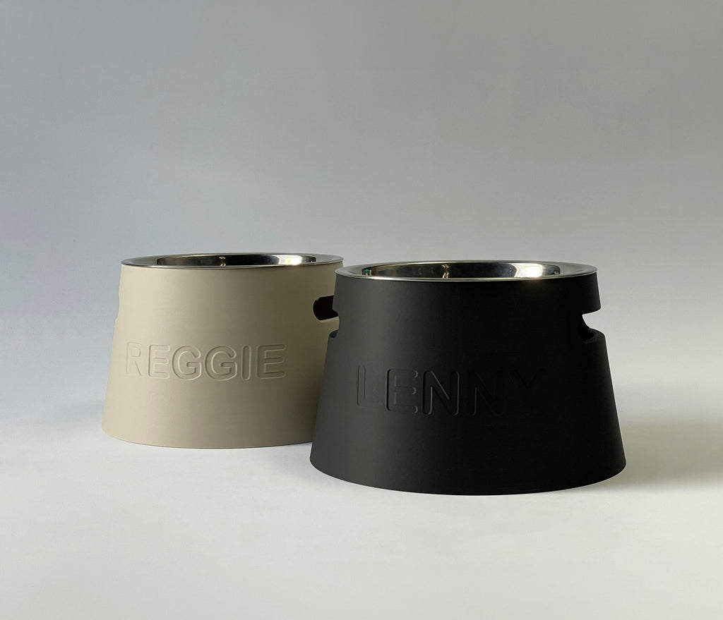 Short classic raised dog bowl stands in cream and black with embossed names