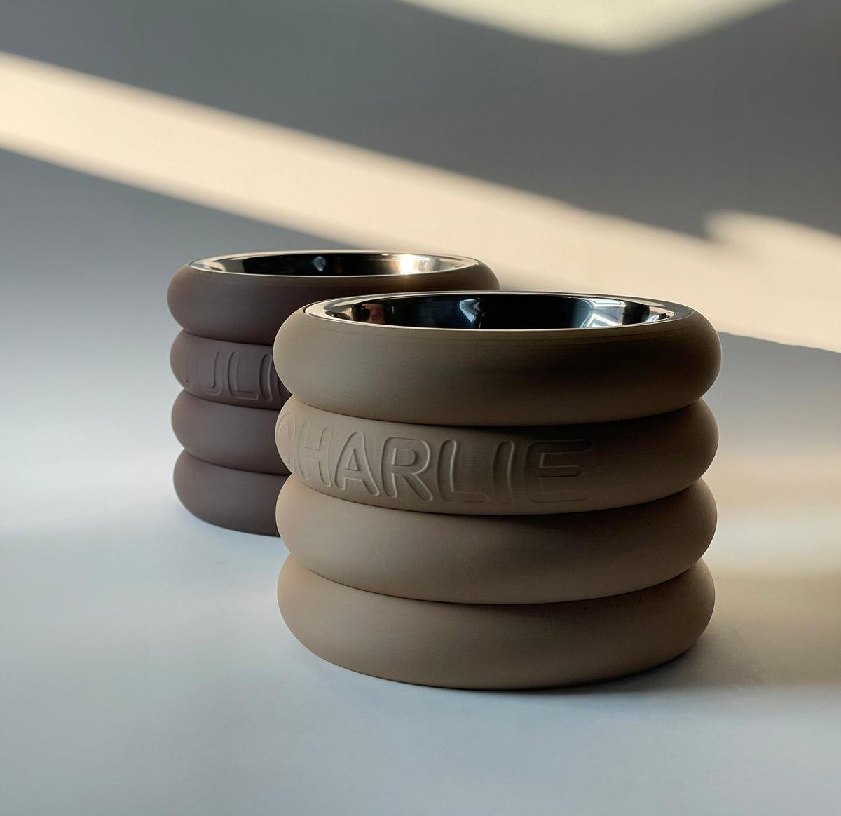 Rings Raised Dog Bowl Stand 12cm in taupe and dark brown with steel bowls in soft sunlight