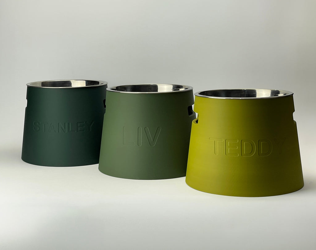 Three classic raised stands in dark green, sage and mustard with steel bowls