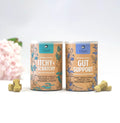Gizzls Itchy & Scratchy and Gut Support tins side by side with biscuits and pink flowers – Skin & Tummy Bundle