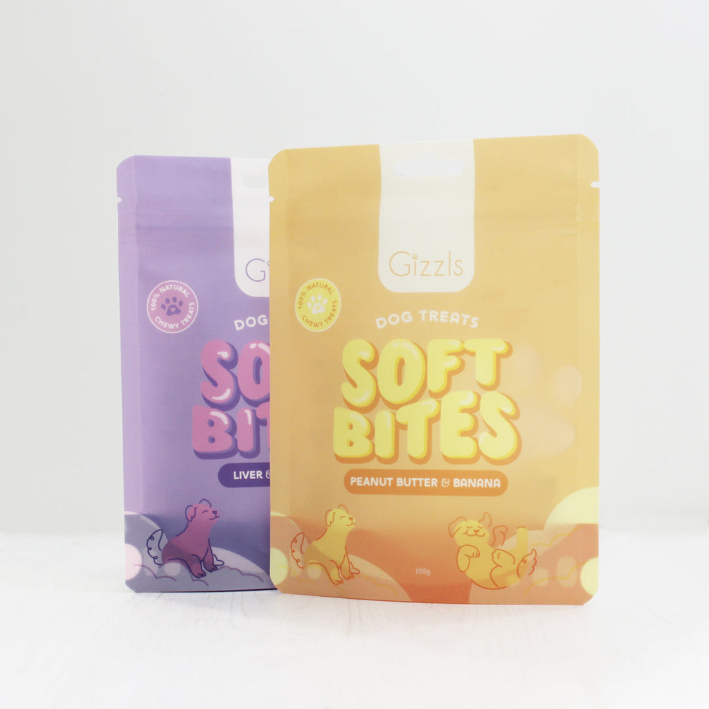 Yellow Peanut Butter & Banana and purple Liver & Blueberry Soft Bites pouches side by side