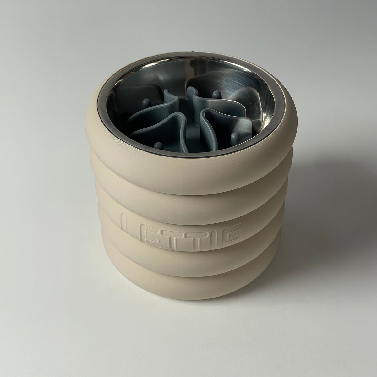 Cream rings raised stand with steel bowl and grey slow feeder insert fitted
