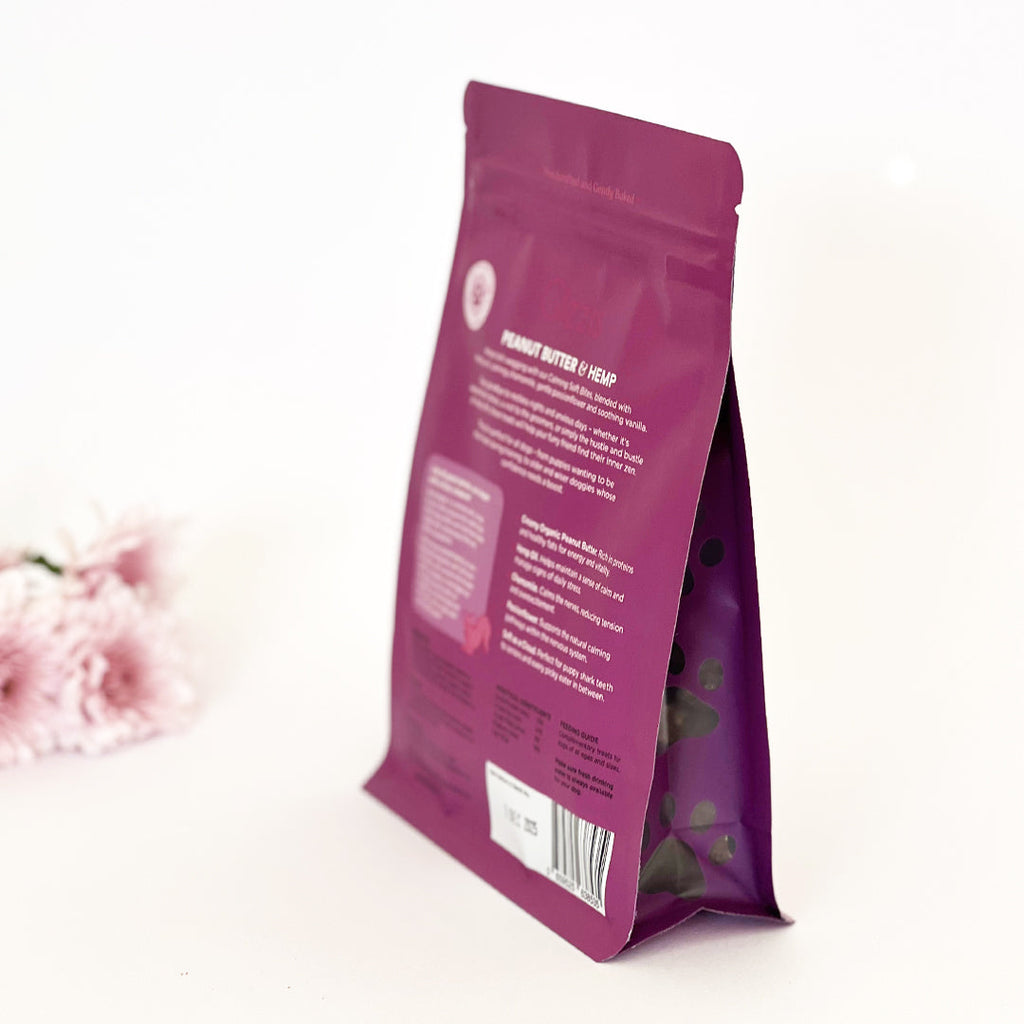 Gizzls Soft Bites Calming bag at an angle with pink flowers behind