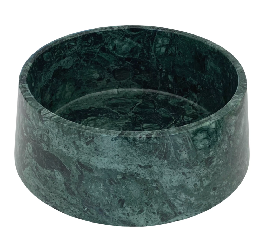 Dark green marble dog bowl with natural veining on a white background