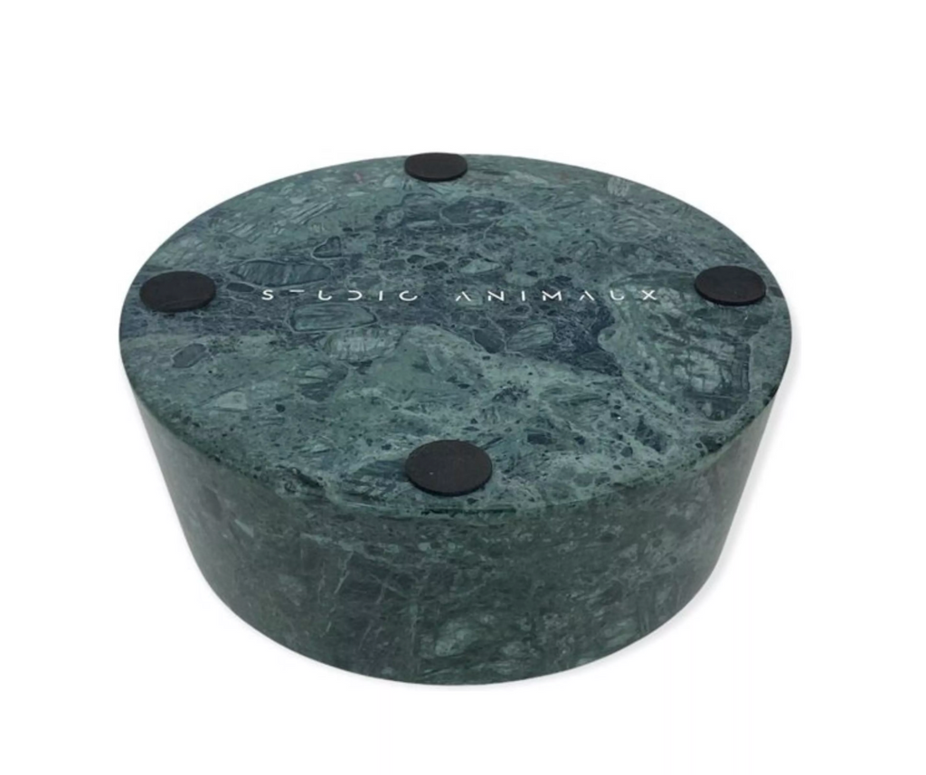 Underside of the green marble dog bowl showing four anti-scratch pads