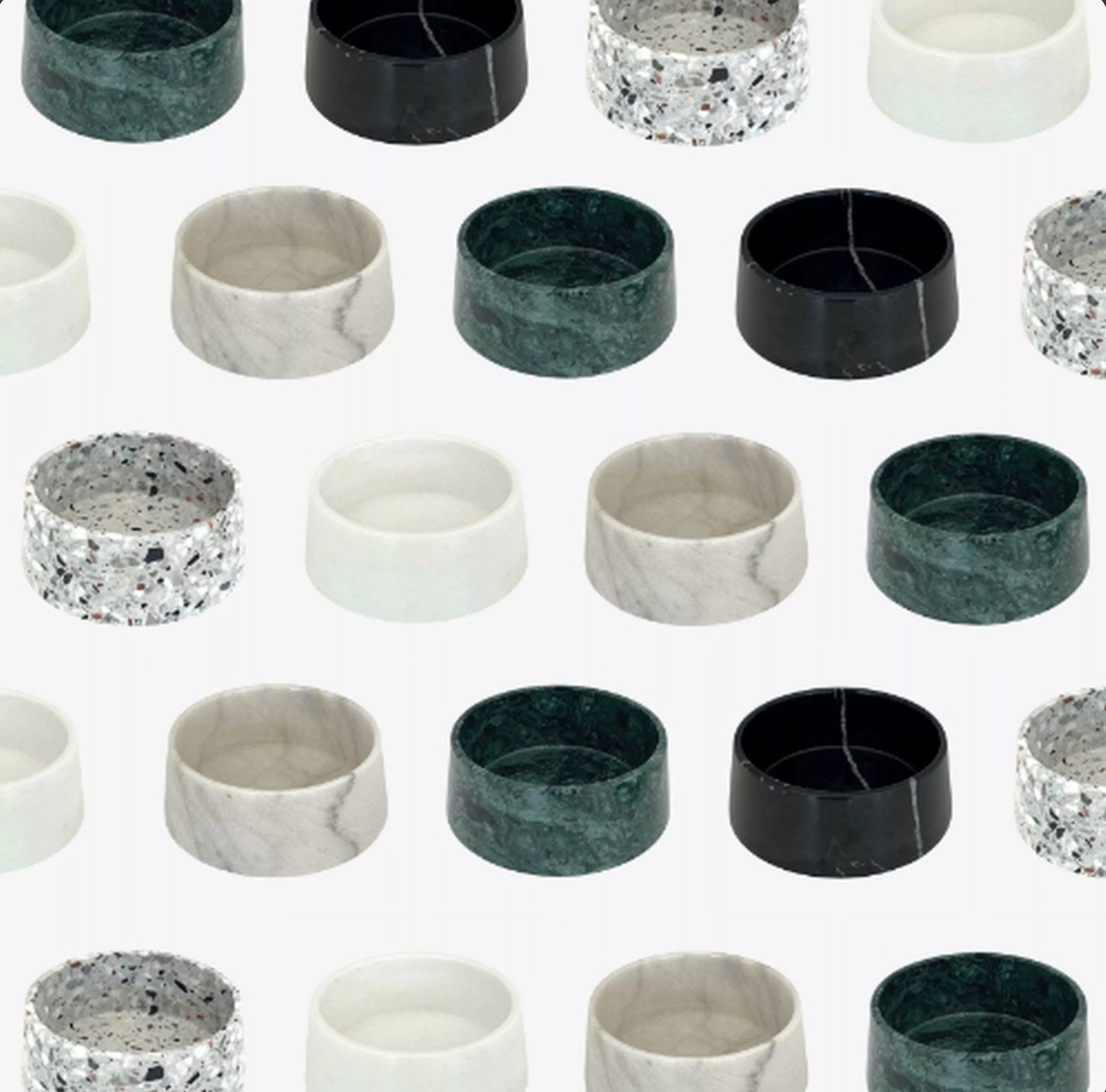 Marble pet bowls in green, black, white and terrazzo finishes arranged in a pattern