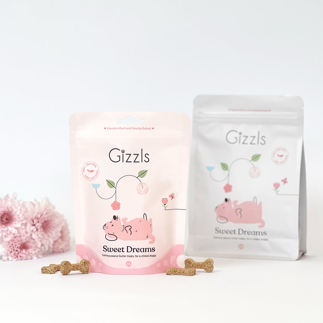 Pink 100g and white 200g Sweet Dreams pouches with biscuits and pink chrysanthemums