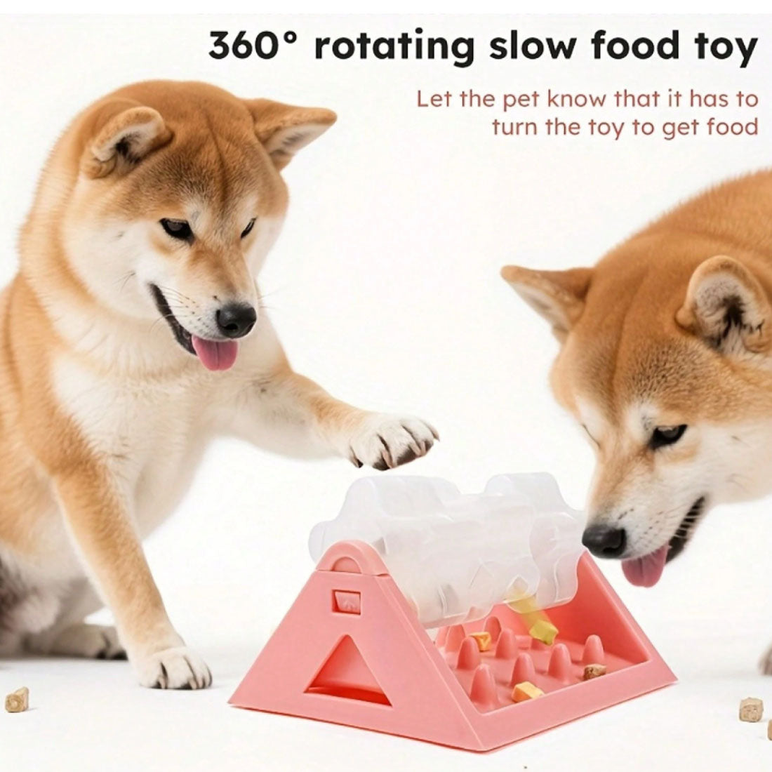 Shiba inus pawing at a pink rotating slow feeder
