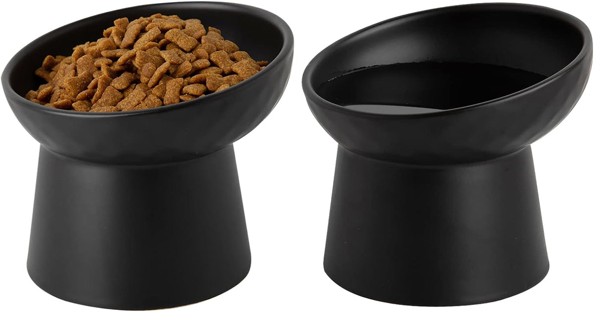 Two black raised ceramic bowls side by side