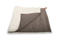 Lincoln reversible dog blanket folded to show brown tweed and cream faux fur sides