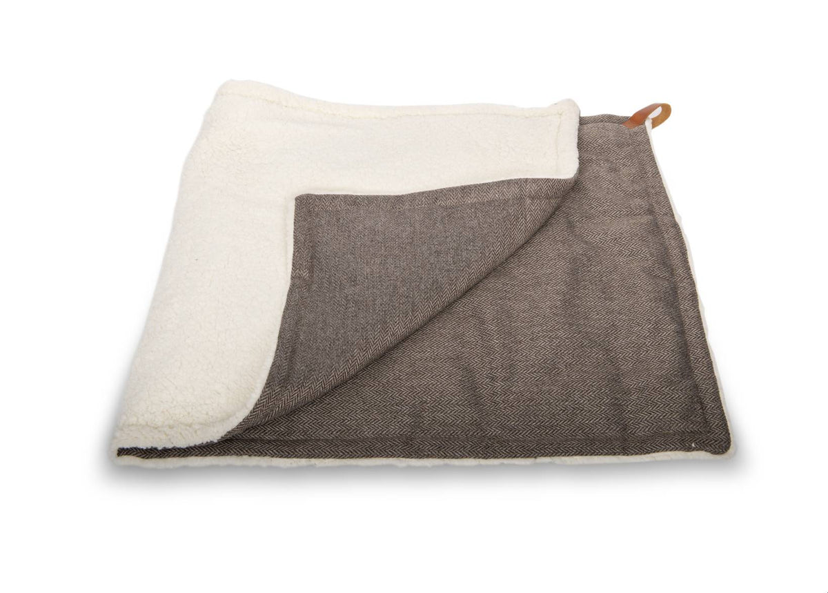 Lincoln reversible dog blanket folded to show brown tweed and cream faux fur sides