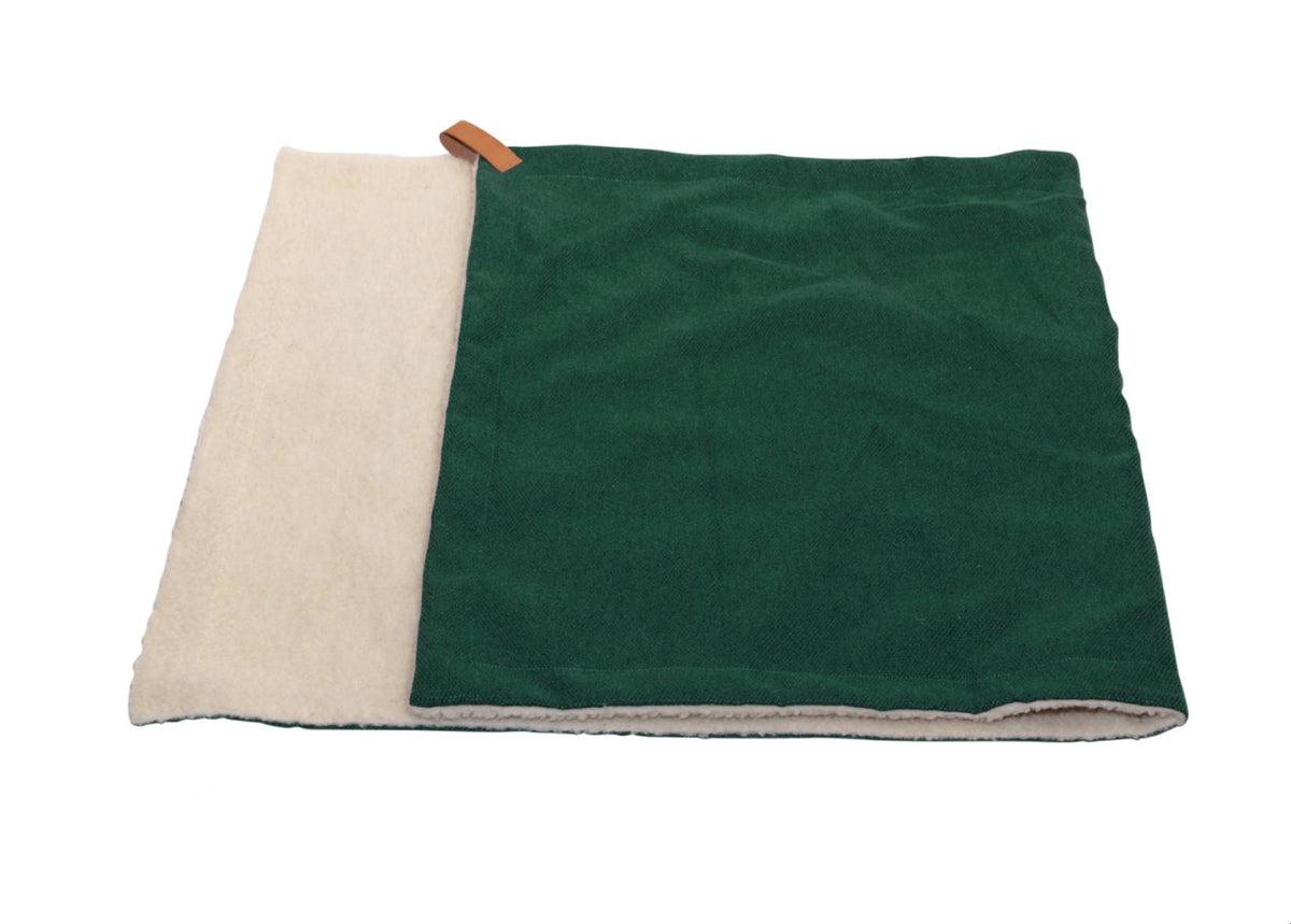 Richmond reversible dog blanket folded to show green stonewashed fabric and cream sherpa side