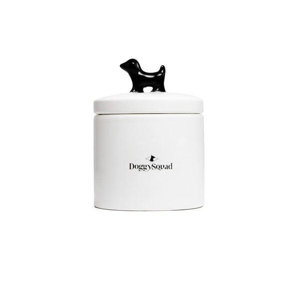 Back of the white ceramic treat jar with small maker's logo and black dog lid handle