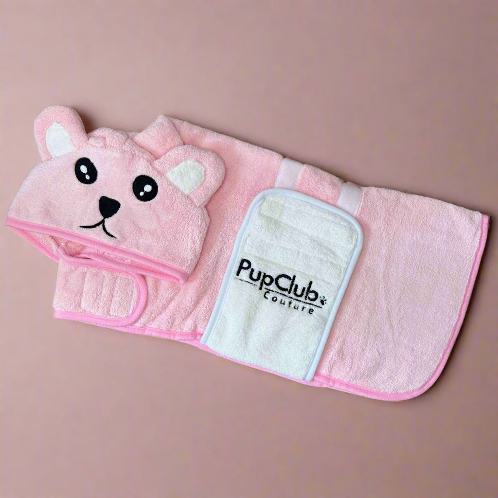 Pink Dog Drying Robe laid flat showing the bear-face hood, white velcro patch and PupClub logo