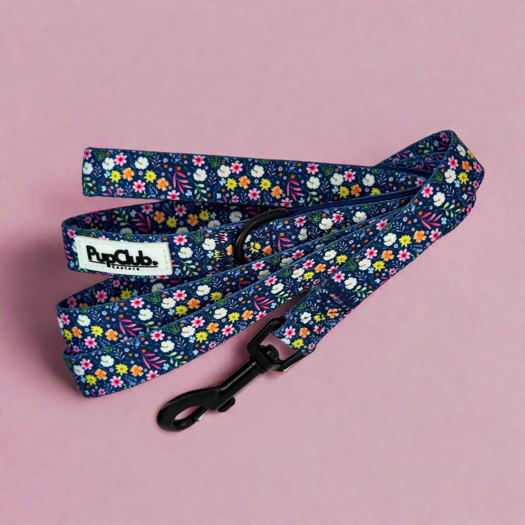 Summer Meadow Dog Lead coiled on pink showing the padded handle and swivel clip