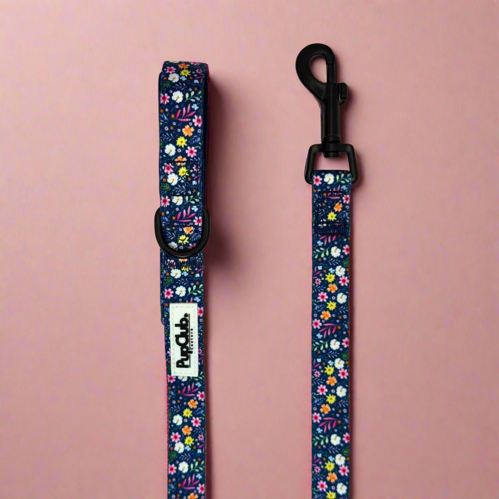 Summer Meadow Dog Lead laid straight on pink, navy with colourful flowers