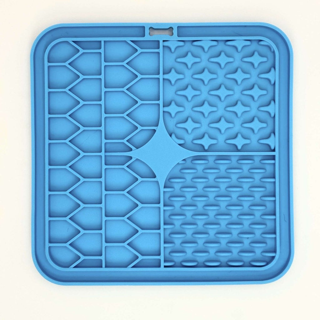 Front of the Blue Silicone Dog Lick Mat with stars, ridges and grooves