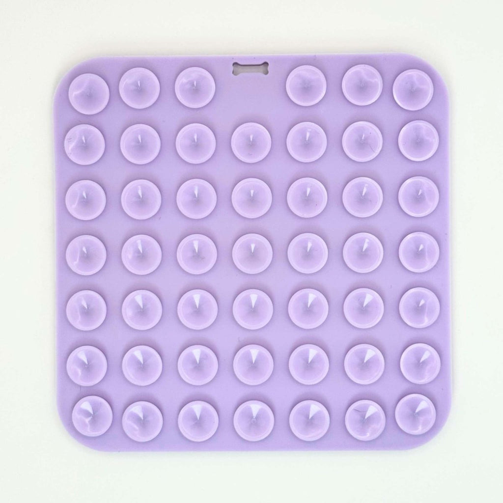 Back of the Lilac Silicone Dog Lick Mat showing rows of suction cups