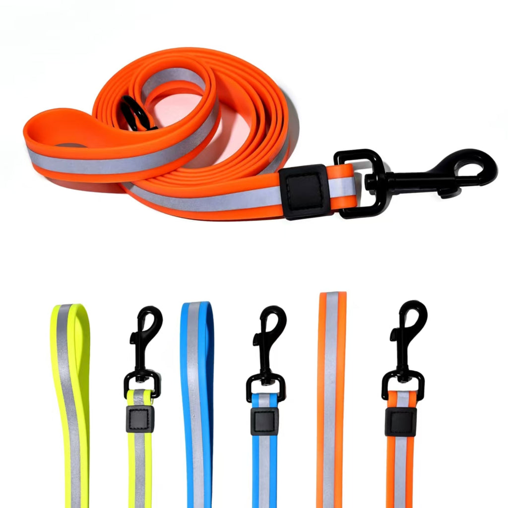 Orange reflective dog lead, with blue, yellow and orange leads laid out below