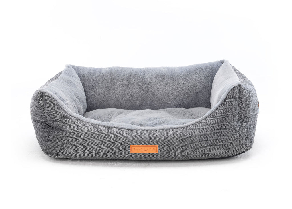 Balmoral grey herringbone bolster dog bed with leather badge