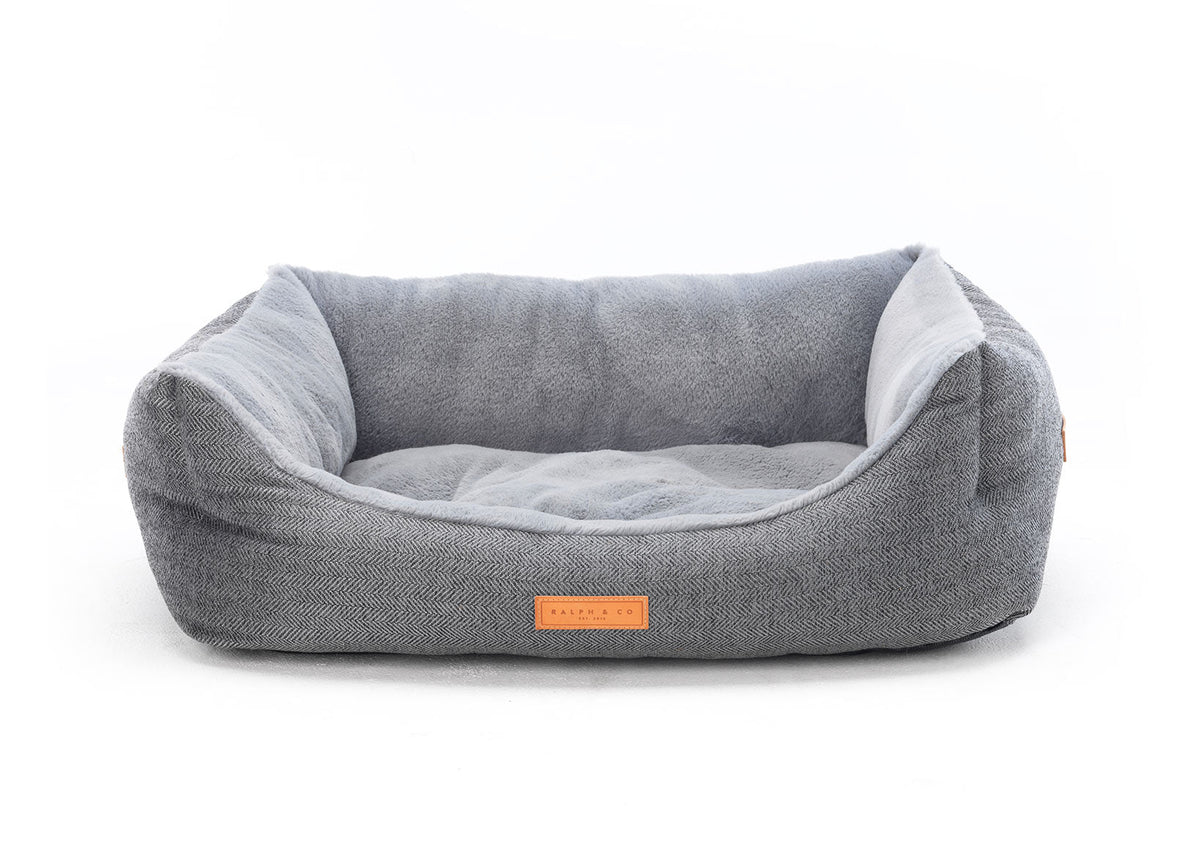 Balmoral grey herringbone bolster dog bed with leather badge