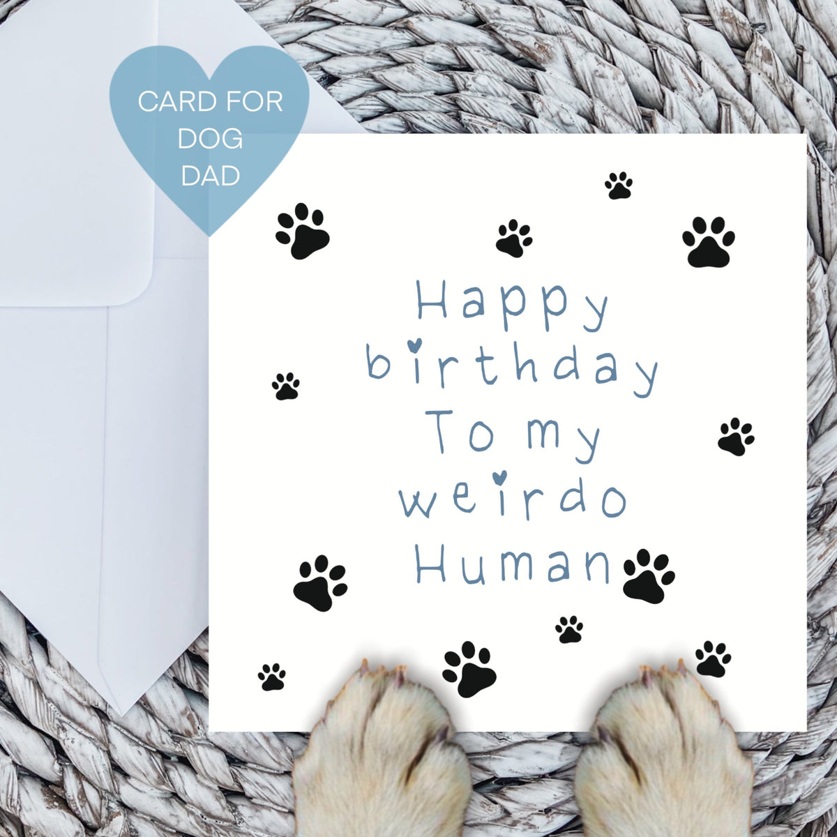 Blue Happy birthday to my weirdo human card with dog paws on a woven mat