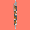 Click pen with repeating Cavalier King Charles Spaniel print on a teal barrel and silver clip