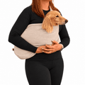 Long-haired dachshund carried in a natural beige Lite Sweatshirt Dog Sling