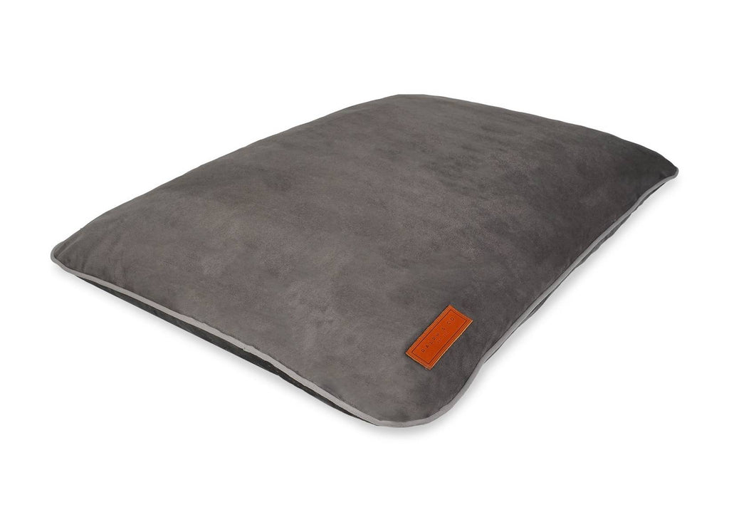 Grey memory foam dog crate mattress shown at an angle with leather Ralph & Co badge