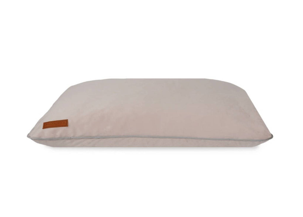 Ralph & Co memory foam dog crate mattress in dusty pink with grey piping and leather badge