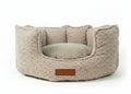 Cotswold round high wall dog bed in oatmeal bouclé with leather badge