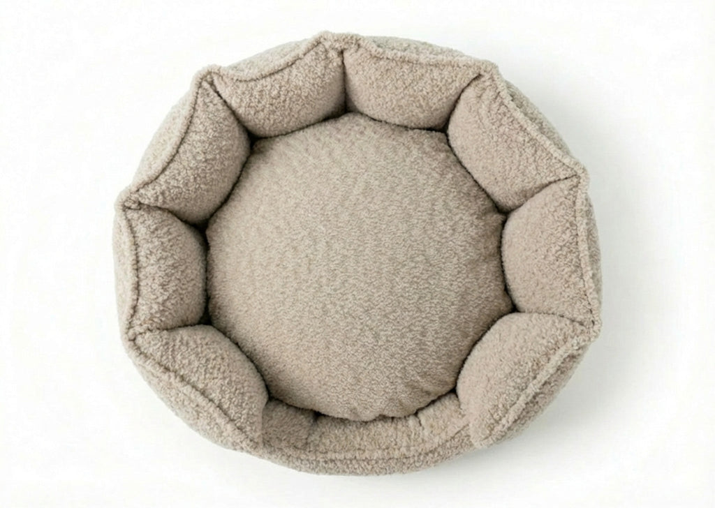 Top-down view of the round Cotswold high wall bouclé dog bed