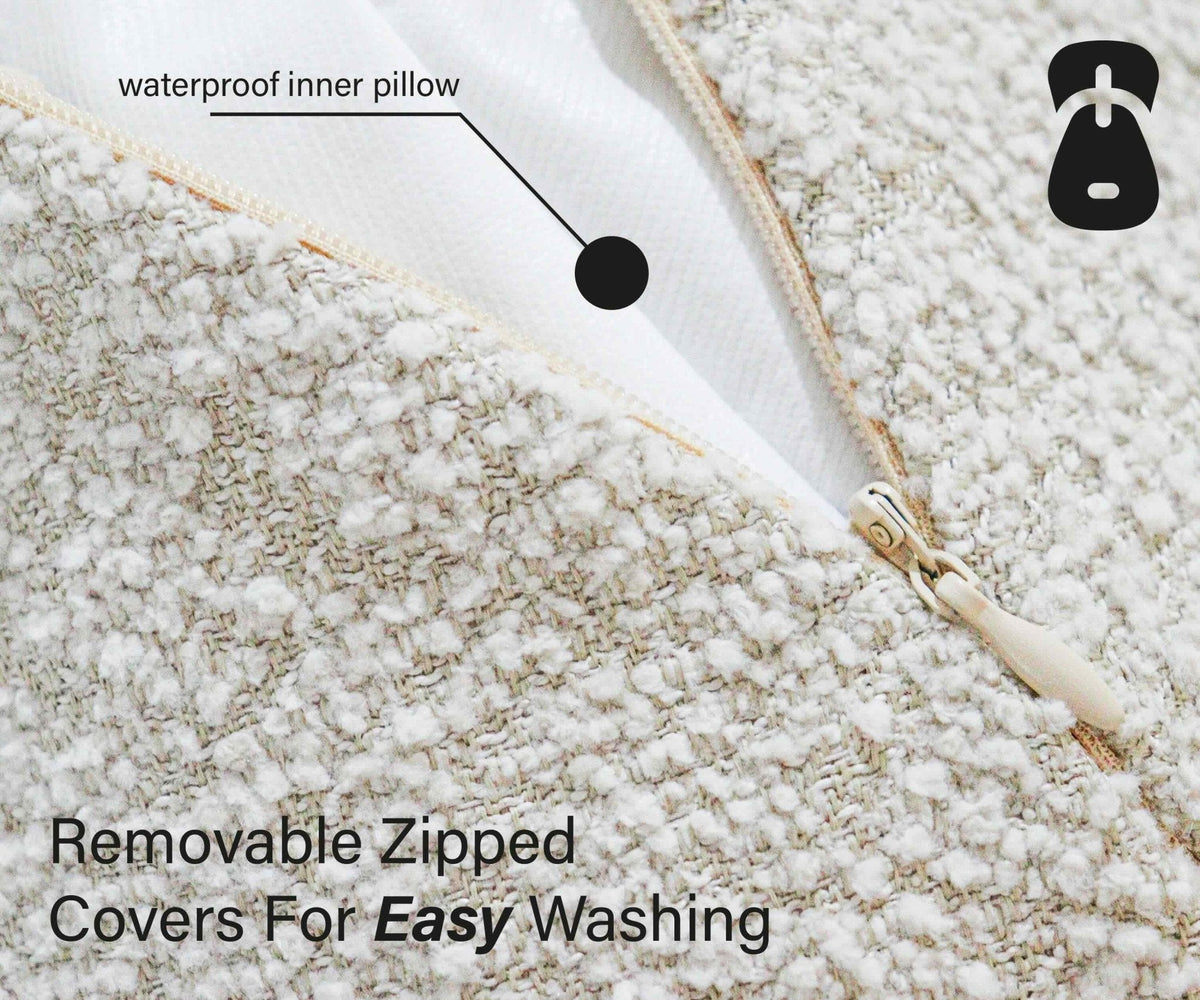 Zip close-up on the Cotswold bouclé bed showing the waterproof inner pillow