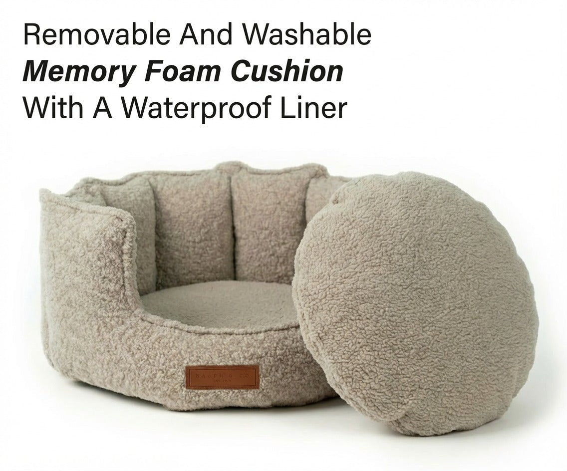 Cotswold oatmeal bouclé bed with its round memory foam cushion removed