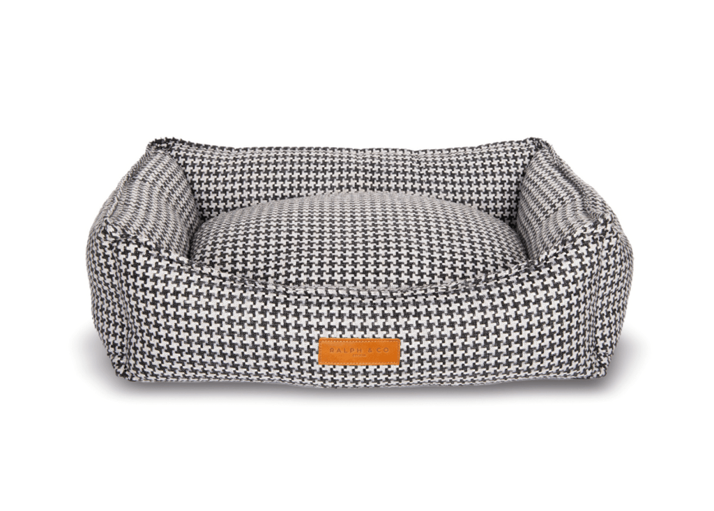 Kensington black and white houndstooth bolster dog bed with tan leather badge