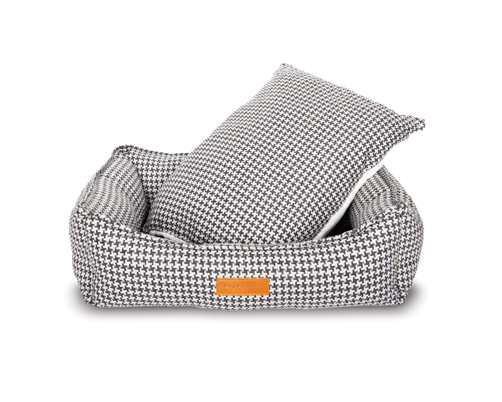 Kensington houndstooth dog bed with its reversible cushion lifted out
