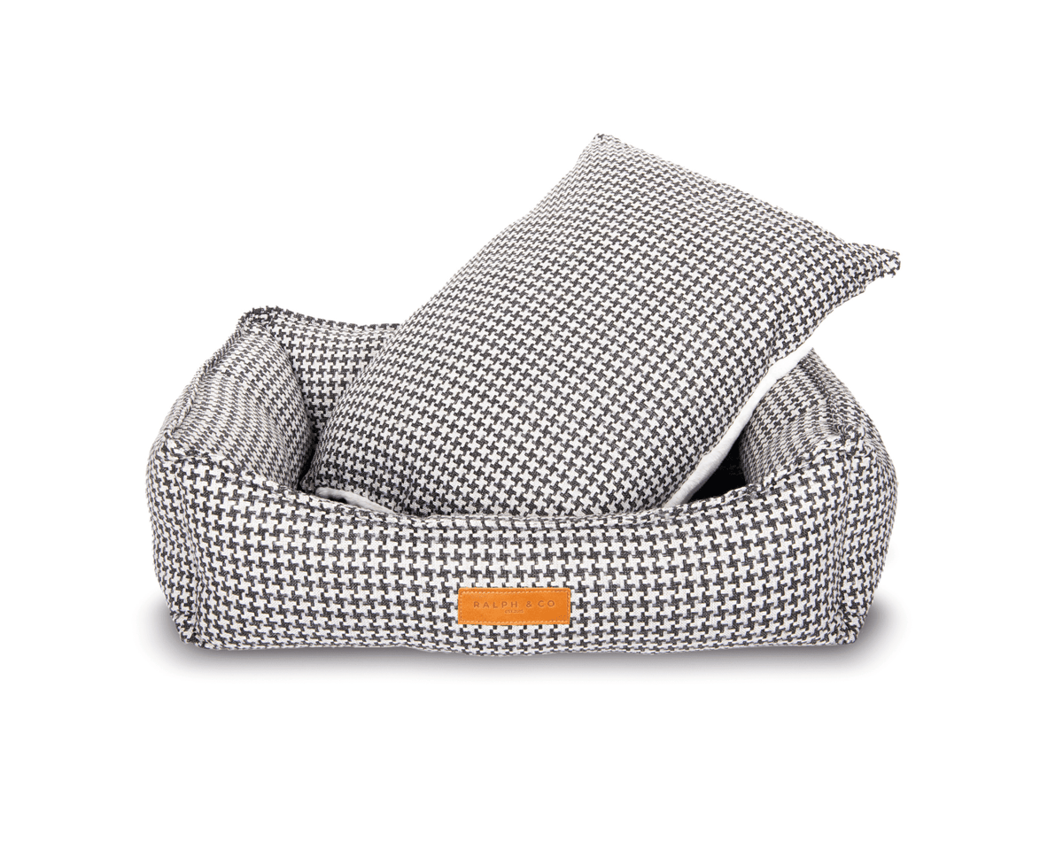 Kensington houndstooth dog bed with its reversible cushion lifted out